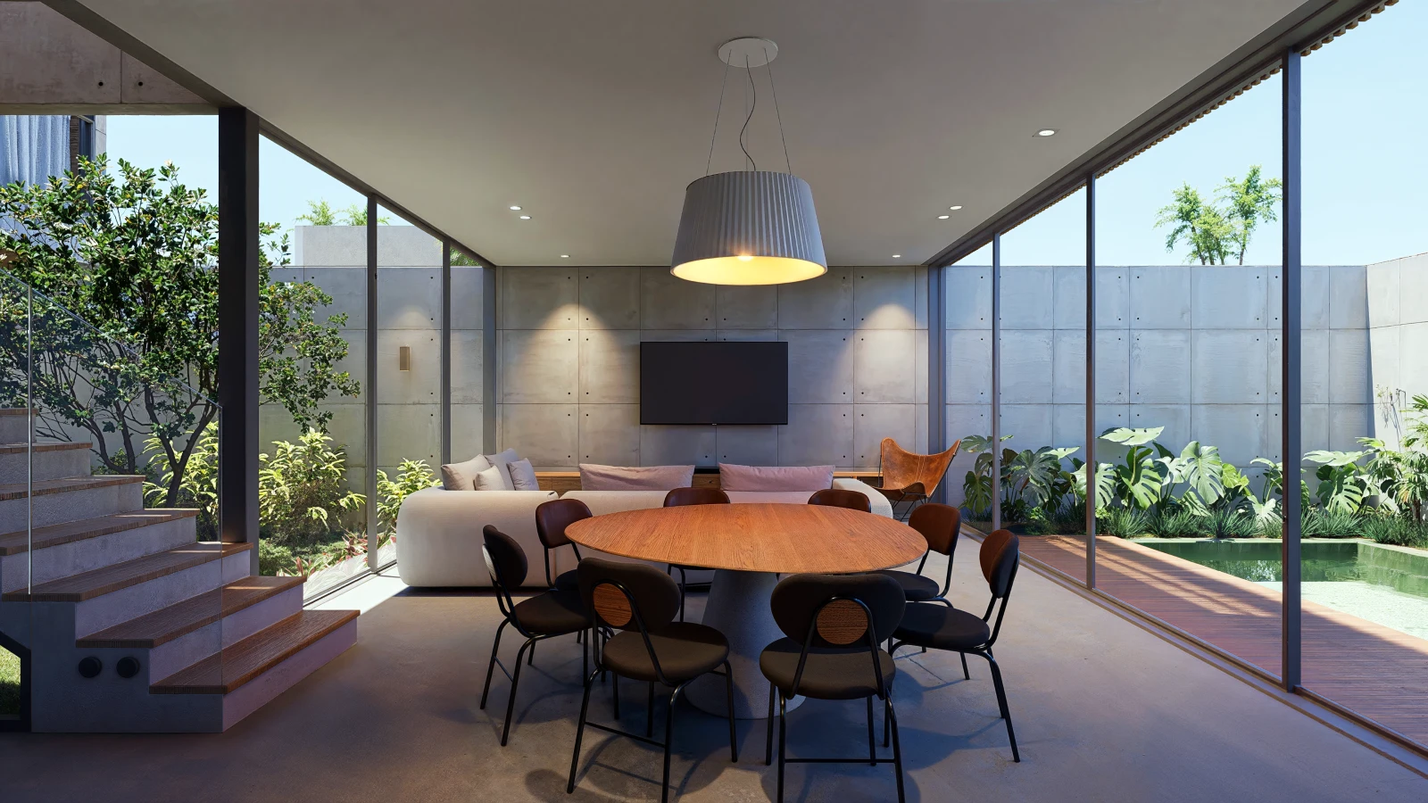 Sala de jantar com mesa redonda integrada à sala de estar e jardim com piscina