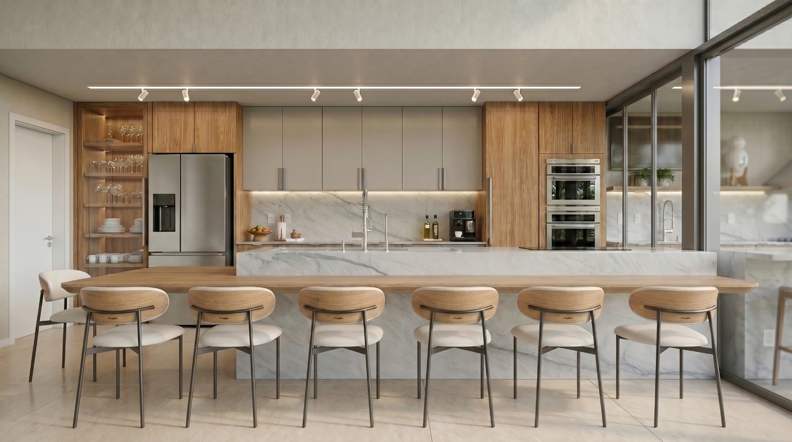 Cozinha gourmet contemporânea com ilha em mármore, marcenaria amadeirada e bancada para refeições.